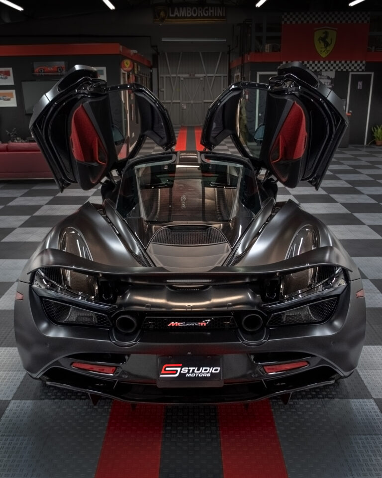 McLaren with doors up in the Studio Motors showroom